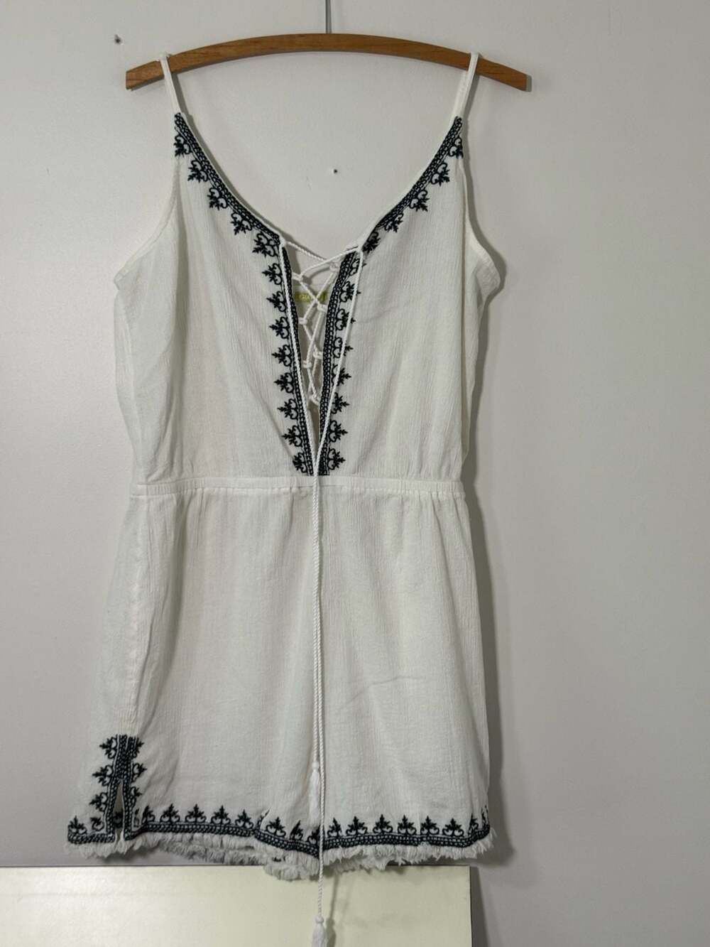 Gianni White Spaghetti Strap Romper with Black Embroidery and Lace-Up Front